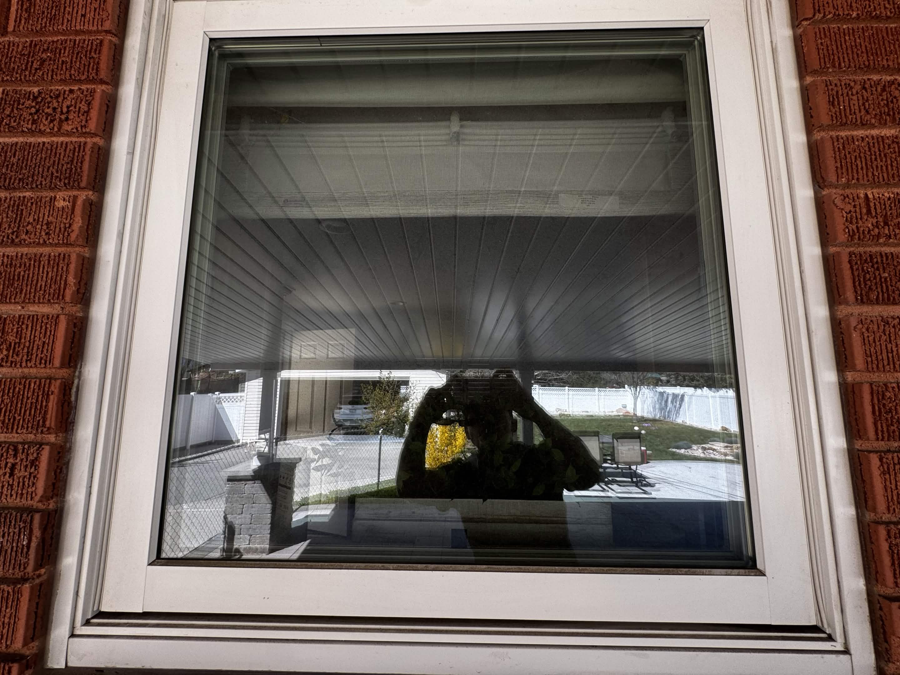 A freshly fitted replacement window screen on a Utah County home.